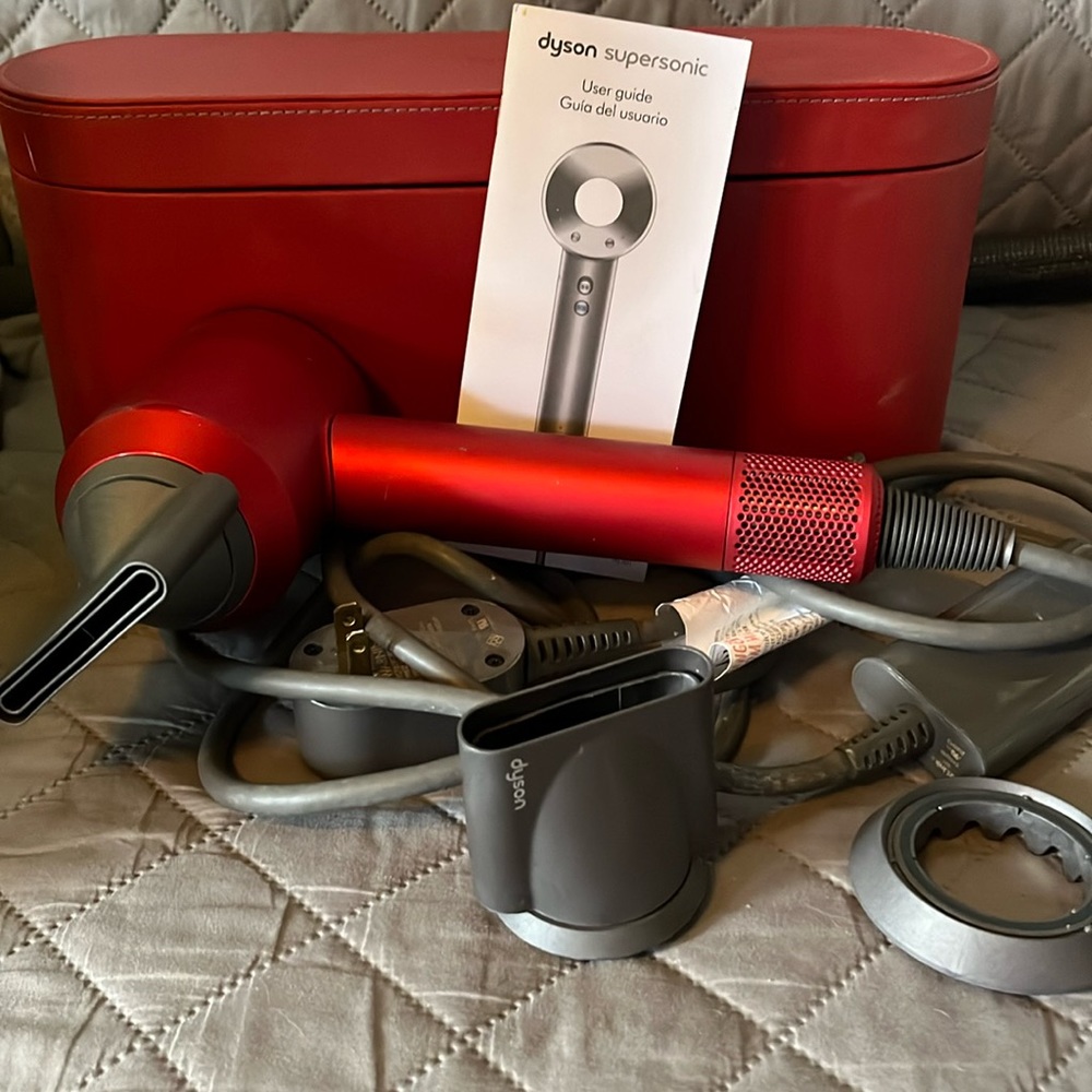 Red Dyson with carrying case & 4 attachments